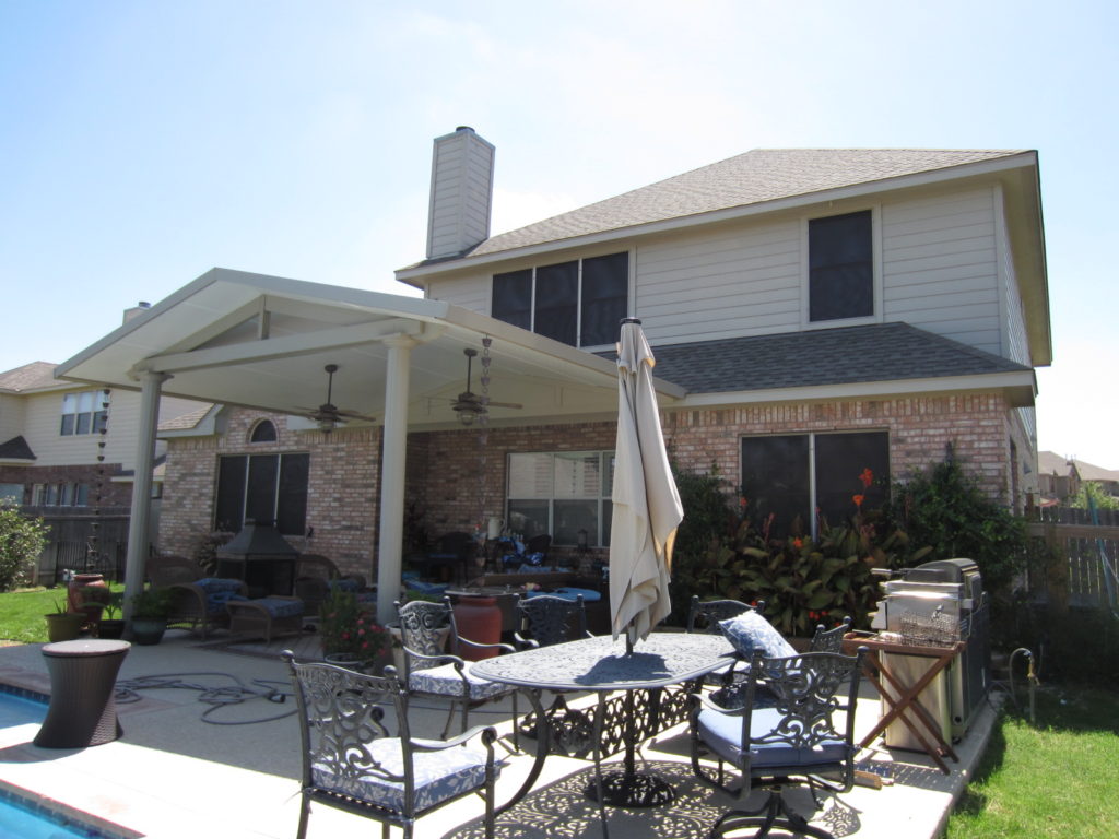 3 windows under patio covering that does not have solar sunshade screens installed on them.