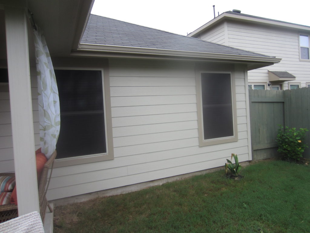 For this vinyl window solar screens installation, we installed four 80% solar window screens on the back side of this home.